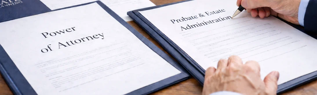 Attorney assisting an older couple with probate and estate administration documents in an office setting {{brizy_dc_image_alt imageSrc=